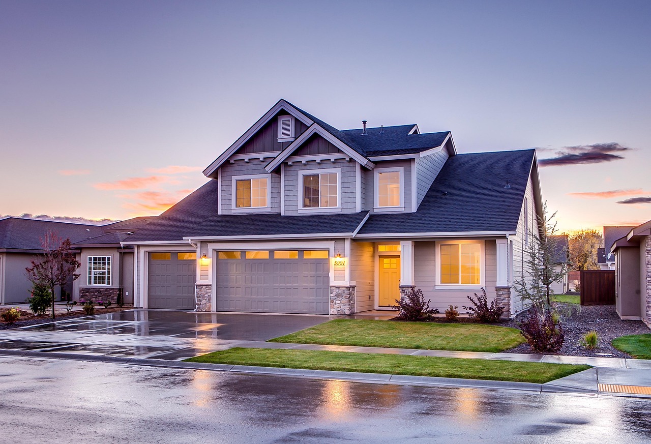 Beautiful home with professionally installed garage doors showcasing installation services