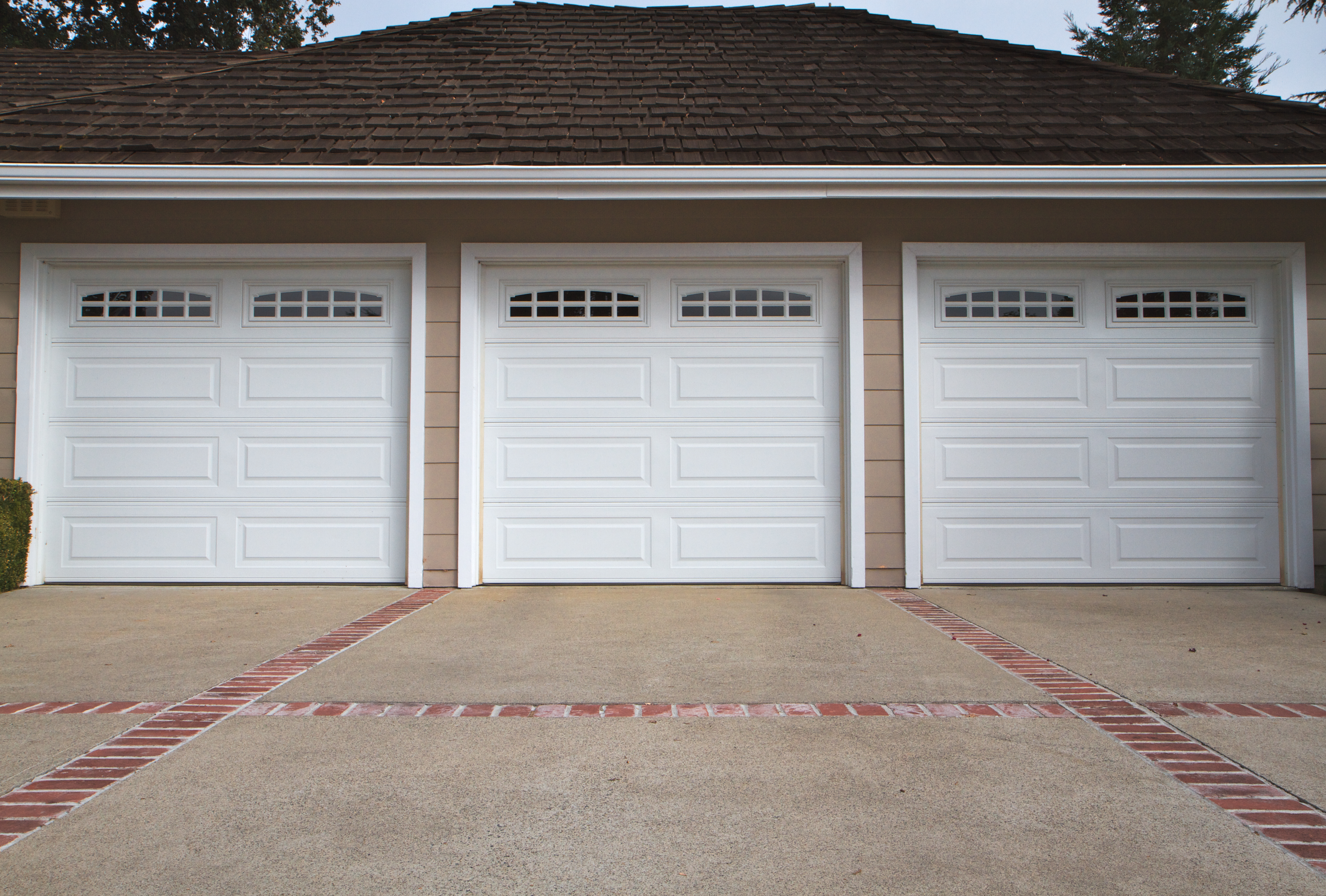 New garage door installation showing complete system setup with tracks springs and hardware in Louisville